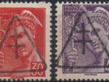 four different colored stamps of different shapes and sizes on a black background