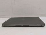 a laptop computer sitting on top of a white table