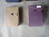 three boxes of cigarettes sitting on a table next to each other