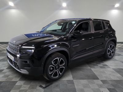 a black jeep is parked in a room with checkered flooring
