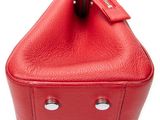 the red purse is open and ready to be used
