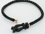 black braided leather bracelet with gold clasp and black clasp