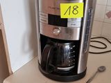 a coffee maker sitting on a counter in a kitchen