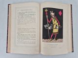 an open book with a picture of a man holding a sword
