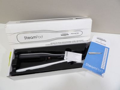 une boîte noire et blanche contenant une brosse à dents
