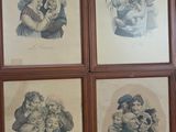 four framed pictures of a woman holding a child in a room