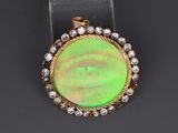 an oplite and diamond pendant