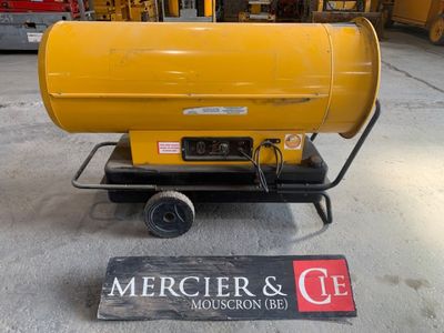 a yellow gas heater sitting on a cart in a garage