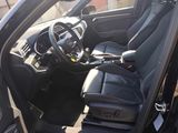 the interior of a car with black leather seats and a steering wheel