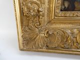 a picture of a gold frame with a painting on it
