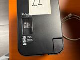a black box with a sticker on it sitting on a desk