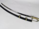 a close up of a pair of swords on a white surface