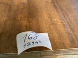 a piece of plywood that has a price tag on it
