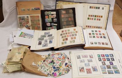 a lot of stamps on a table with a book