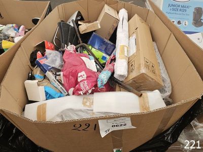 a cardboard box filled with assorted items in a store