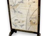 a picture of a decorative screen with birds on it