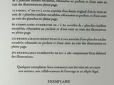 an open book with a black and white text on it