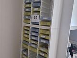 many bins and boxes on the shelves in the room