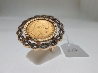 an image of a gold ring with a coin in the middle
