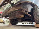 a close up of a car that is under the car