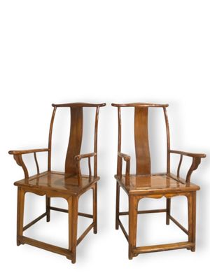 two wooden chairs with arms and arms are sitting next to each other