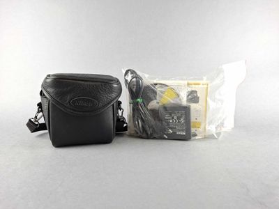 a black camera bag with a camera attached to it