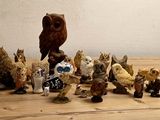 a lot of figurines that are sitting on a table