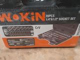 a close up of a box of tools on a table
