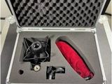 a silver case with a red umbrella inside of it