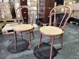 two chairs sitting next to each other in a room