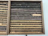 many different type of letters in a wooden box