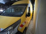 a yellow van that is parked in a garage