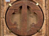 a picture of a wooden frame with a circular window