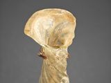 a close up of a statue of a woman wearing a veil
