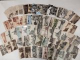 a lot of old postcards that are on a table