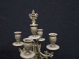 antique brass candelabra with five candles on a marble base