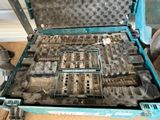 a blue case with tools inside of it on the floor