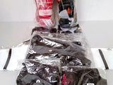 bags of clothing are wrapped in plastic on a white surface