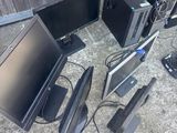 a lot of computer equipment that are sitting on the ground