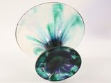 a glass vase with a blue and green design on it