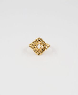 an image of a gold ring with a pearl in the center