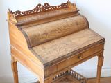 a wooden desk with a wooden top and a wooden base