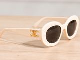 the sunglasses are white and have a gold logo on them