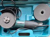 a blue tool box with a couple of tools in it