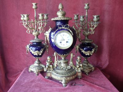 a blue and gold clock sitting on a table
