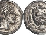 a silver coin with an image of a man and a woman on it