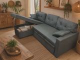 a couch with a pull out bed in the middle of a living room