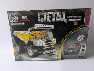 a box with a toy truck in it on a table