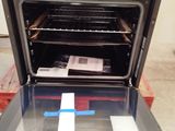 an open oven with the door open on a pallet