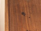 a cat that is sitting on top of a wooden table